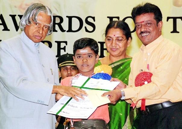 The academic award this boy is receiving may contribute to his sense of industry.