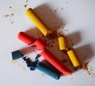 Three pieces of broken chalk