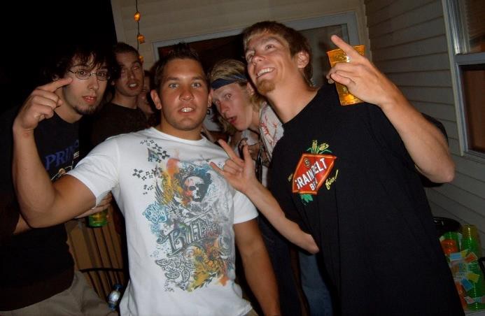 Adolescent boys drinking at a party.